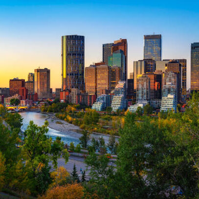 Sunset above city skyline of Calgary with Bow River, Alberta, Canada.